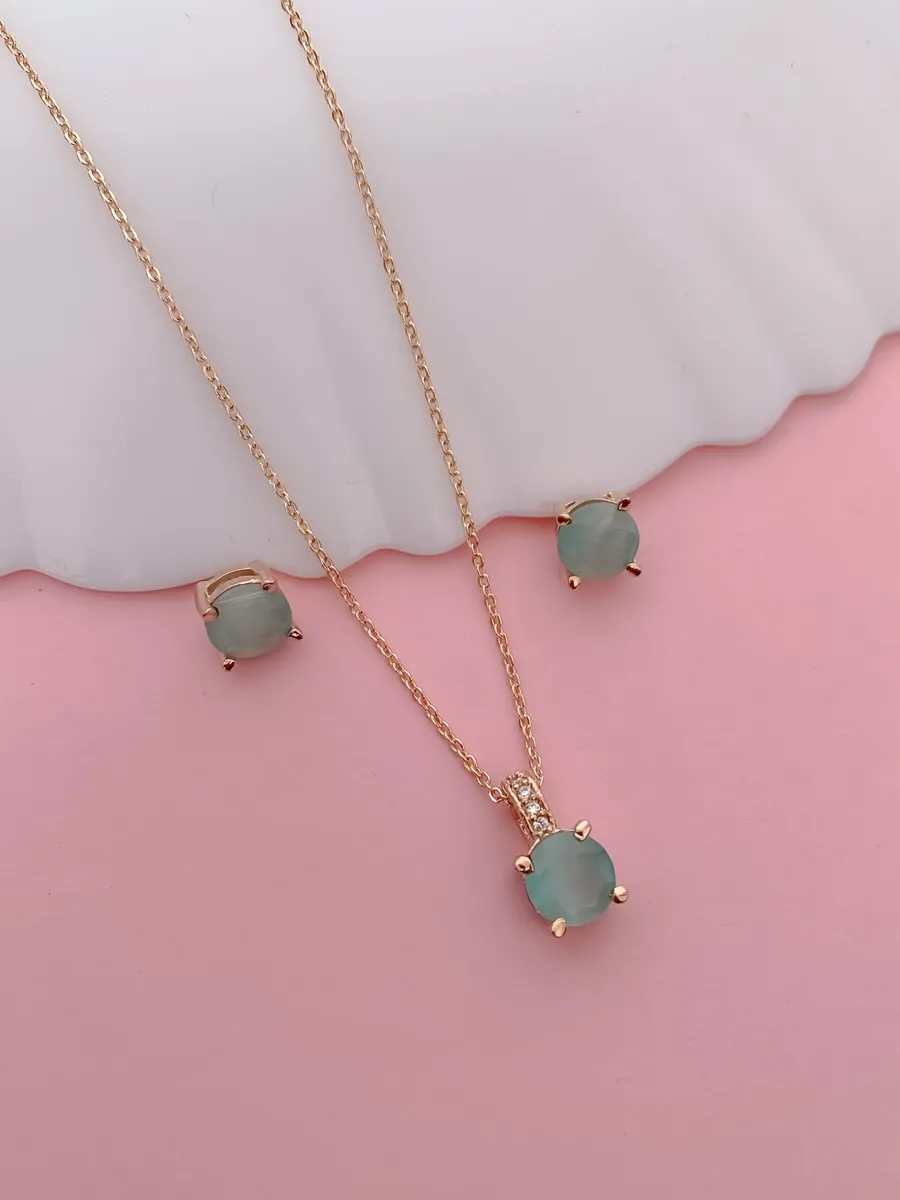 Elegant Aqua Stone Pendant Set in Rose Gold Finish
